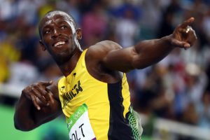 Usain Bolt celebrates after winning gold. (Photo: Reuters)