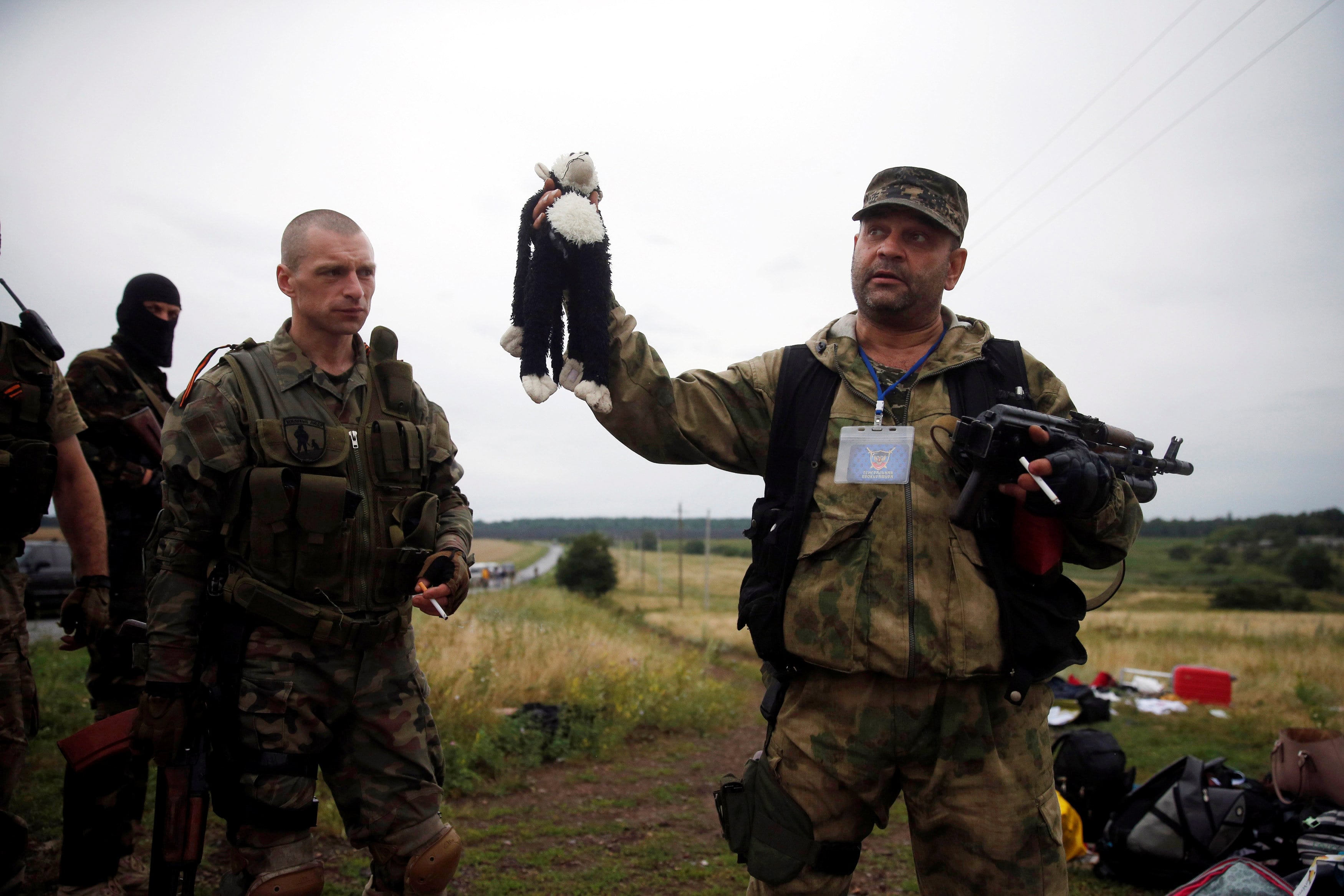 A pro-Russian separatist holds a stuffed toy found at the crash site near the settlement of Grabovo in the Donetsk region, July 18, 2014. (Photo: Reuters)