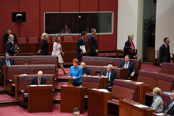 Green Party senators walk out as Senator Pauline Hanson (C) makes her maiden speech in the Senate. (Photo: AAP/Mick Tsikas/via Reuters)