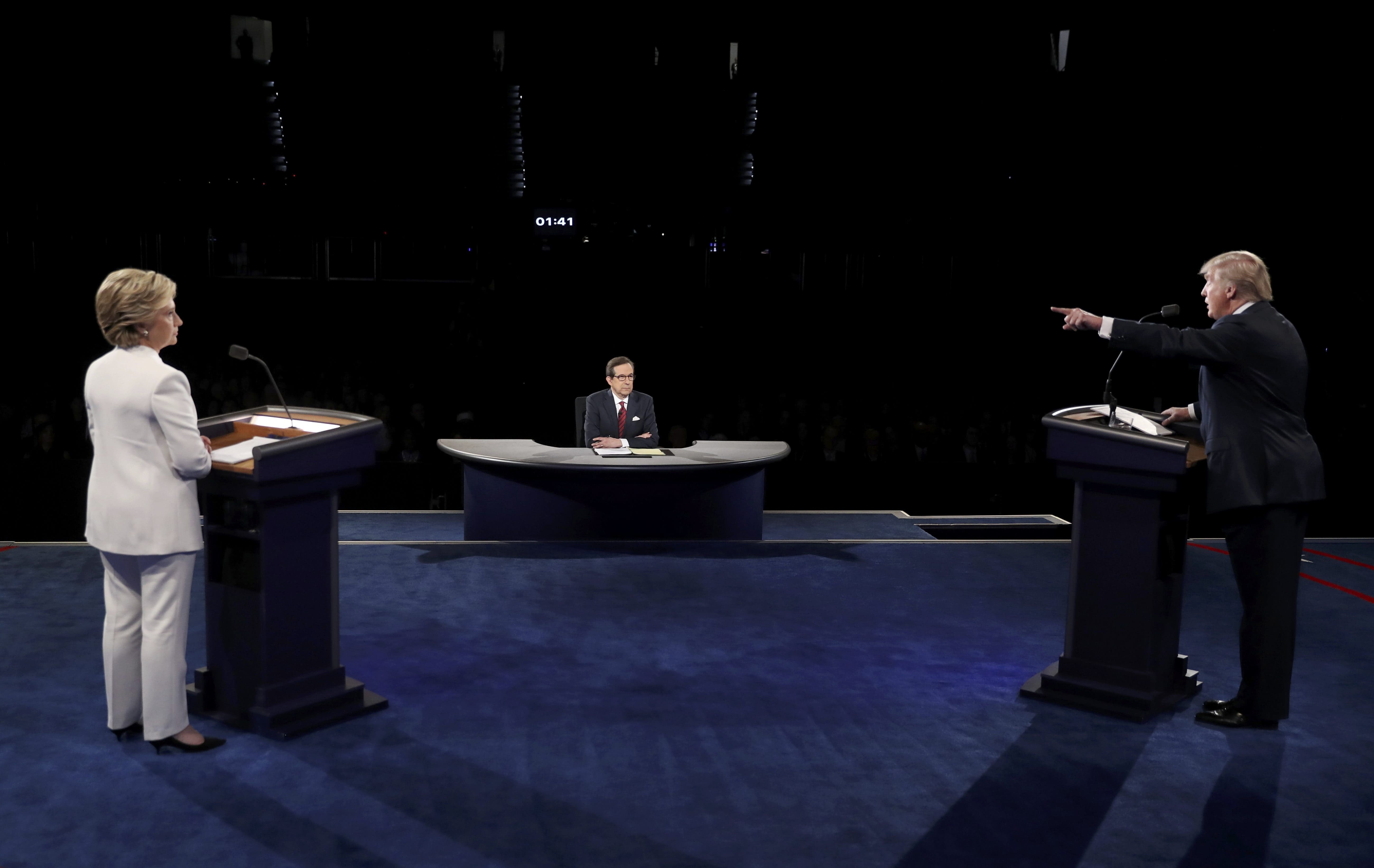 Donald Trump speaks as Hillary Clinton listens during their third and final 2016 presidential campaign debate. (Photo: Reuters)