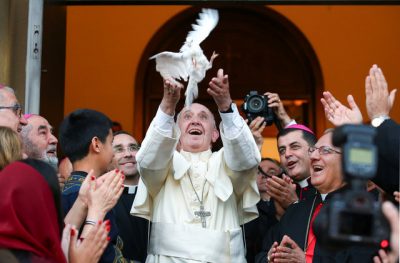 Pope Francis releases a dove at the end of a visit to the Chaldean Catholic Church of St. Simon Bar Sabbae in Tbilisi, Georgia, September 30, 2016. REUTERS/Alessandro Bianchi