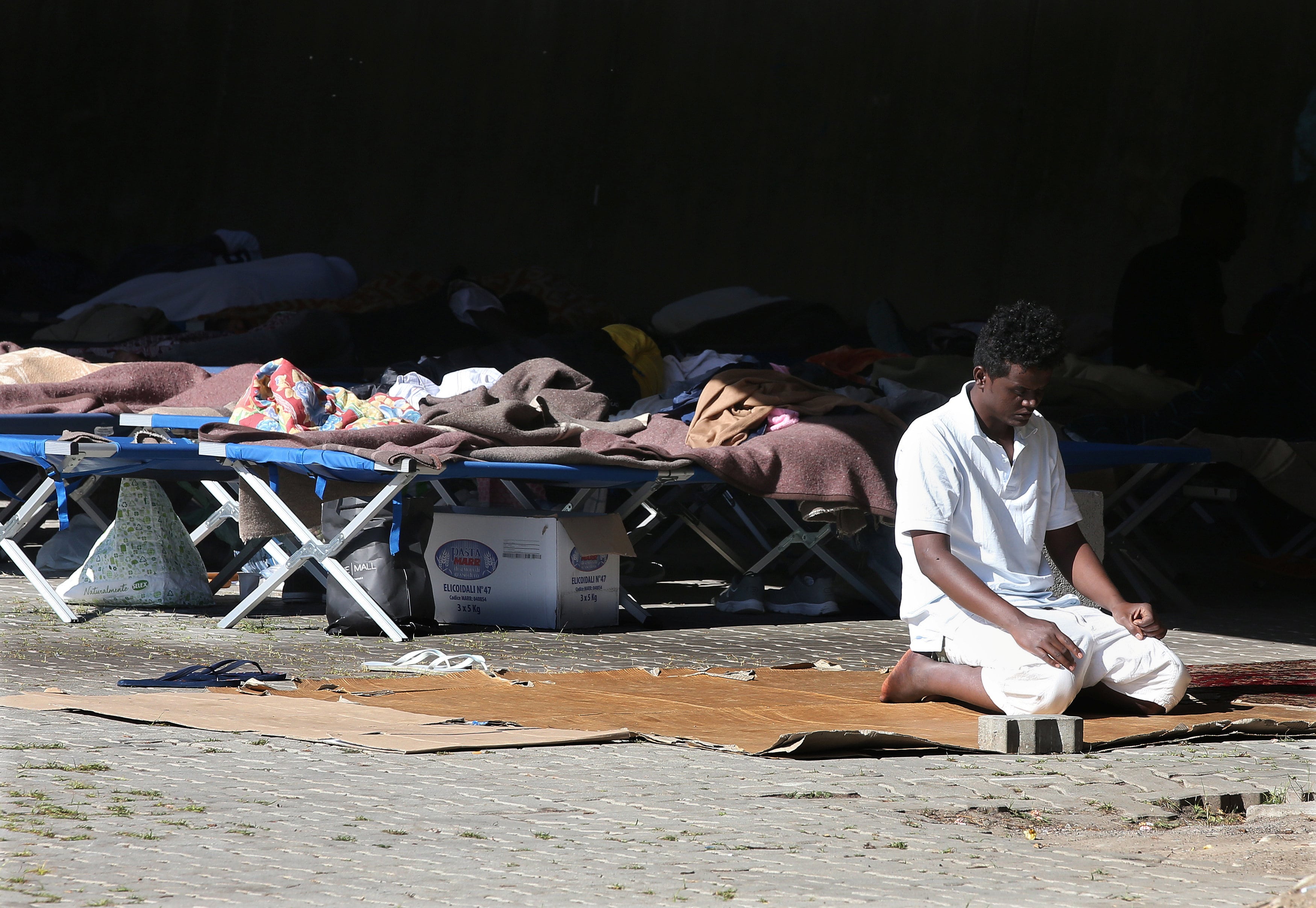 A migrant prays at the Italian Red Cross camp in Ventimiglia, Italy. (Photo: Reuters)