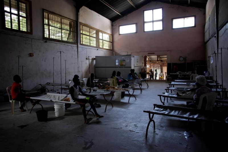 Patients rest on stretchers in the Cholera Treatment Centre of Diquini. (Photo: Reuters)