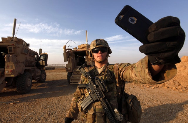 An American soldier takes a selfie at the US army base in Qayyara, south of Mosul October 25, 2016. (Photo: Reuters)