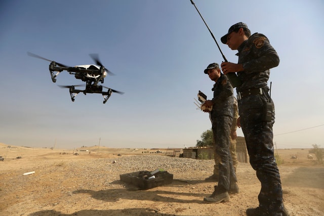 A member of Iraqi forces operates an unmanned drone to make it fly over Islamic State position outside the town of Safayah near Mosul, Iraq October 23, 2016. (Photo: Reuters)