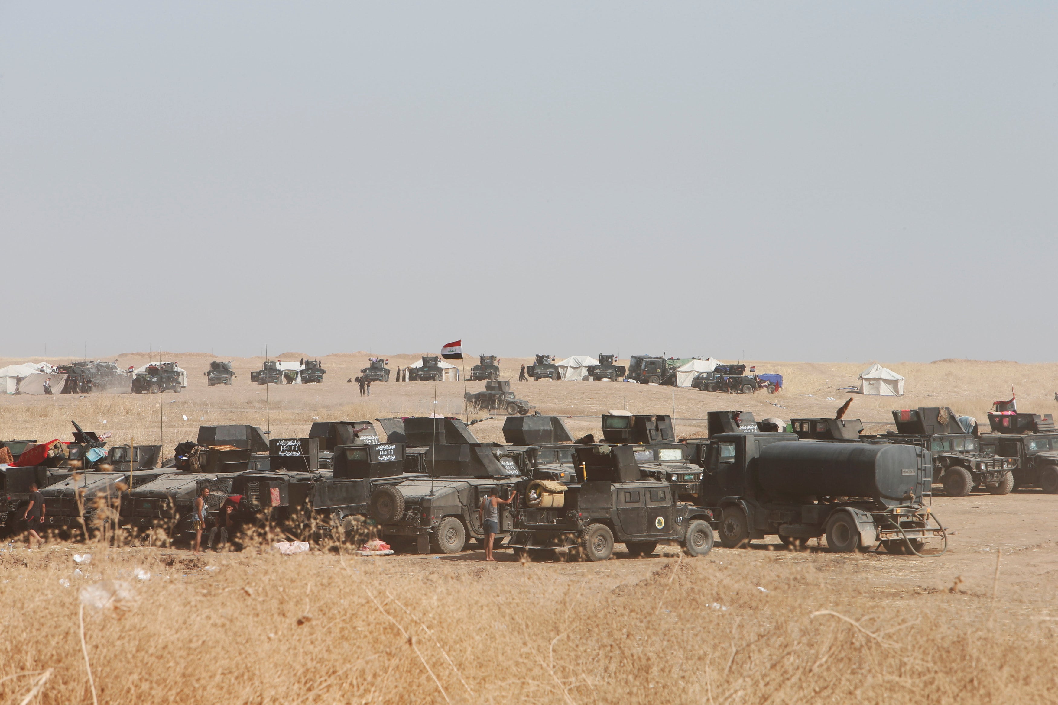 Military vehicles for the Iraqi security forces are seen on the east of Mosul during preparations to attack Mosul, Iraq, October 15, 2016. (Photo: Reuters)