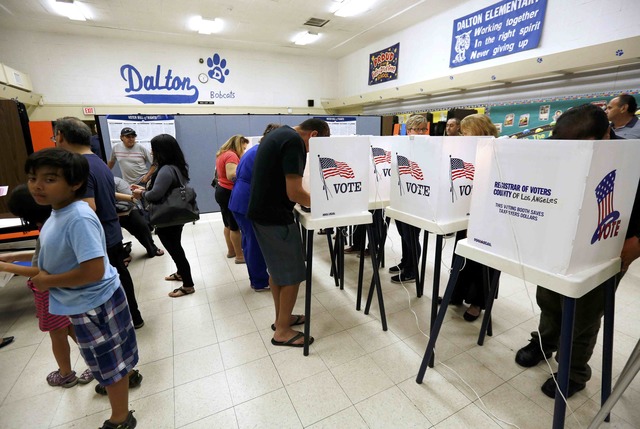 Voters cast their ballots in the Dalton Elementary School after the polling station  was reopened following the shooting in the area.  (Photo: Reuters)