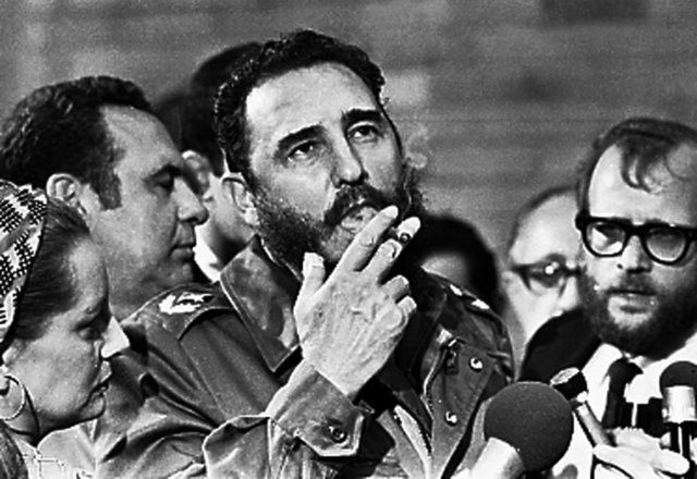 Then Cuban Prime Minister Fidel Castro smokes a cigar during interviews with the press during a visit of US Senator Charles McGovern, in Havana in this May 1975 file photo. (Photo: Reuters/ File Photo)