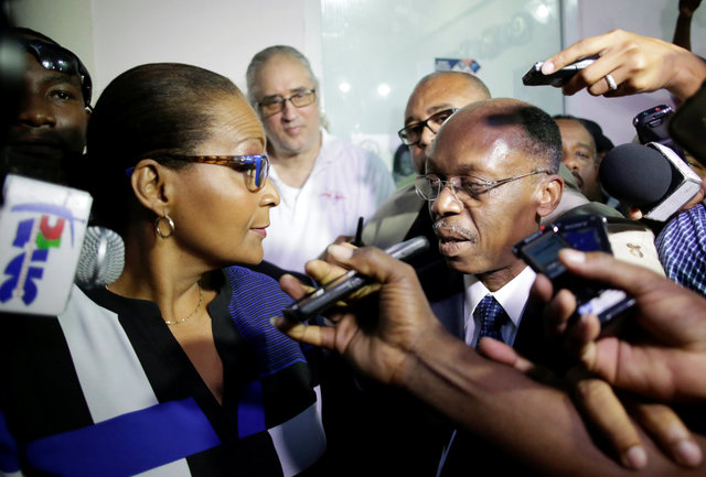 Presidential candidate Maryse Narcisse, of Fanmi Lavalas party, and former President Jean-Bertrand Aristide speak to each other after a meeting at the Electoral Provisional Council in Petion Vile, Port-au-Prince, Haiti, November 11, 2016. (Photo: Reuters)