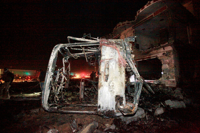 Destroyed vehicles are seen at the site of a suicide truck bomb attack, at a petrol station in the city of Hilla south of Baghdad, Iraq, November 24, 2016. (Photo: Reuters)