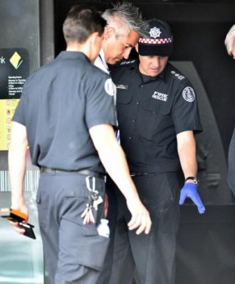 Emergency service workers are seen at a branch of the Commonwealth Bank after a fire injured customers in Melbourne, Australia November 18, 2016. (Photo: AAP/Julian Smith/via Reuters)
