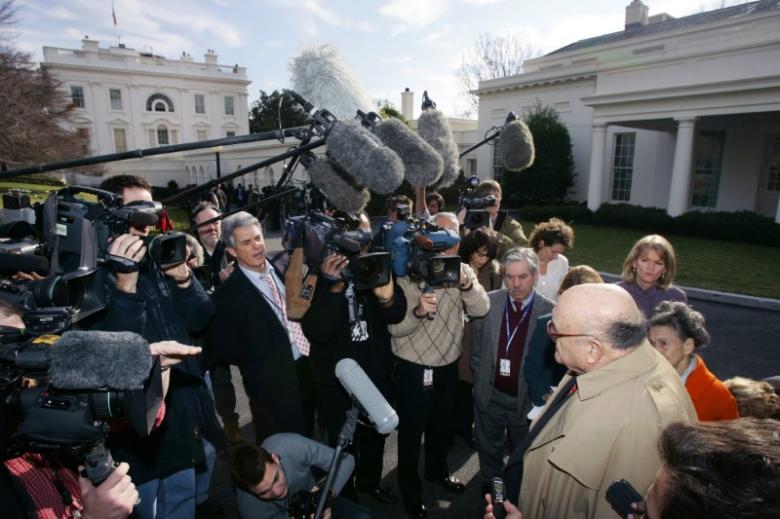 File Photo - Former Nixon U.S. Secretary of Defense Melvin Laird is surrounded by reporters as he departs the White House in Washington, January 5, 2006.  REUTERS/Kevin Lamarque
