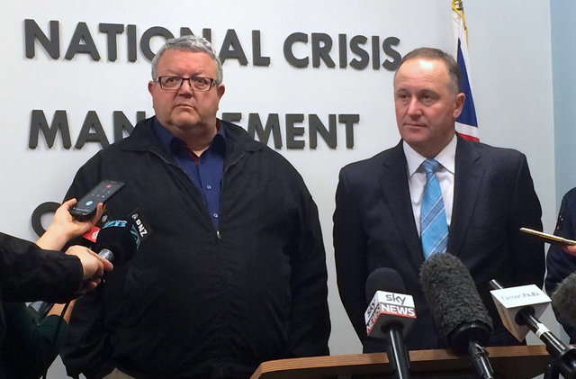New Zealand Prime Minister John Key (R) stands with acting minister for civil defence Gerry Brownlee as they listen to a question from a journalist during a media conference in Wellington, New Zealand, November 14, 2016.   (Photo: Reuters)