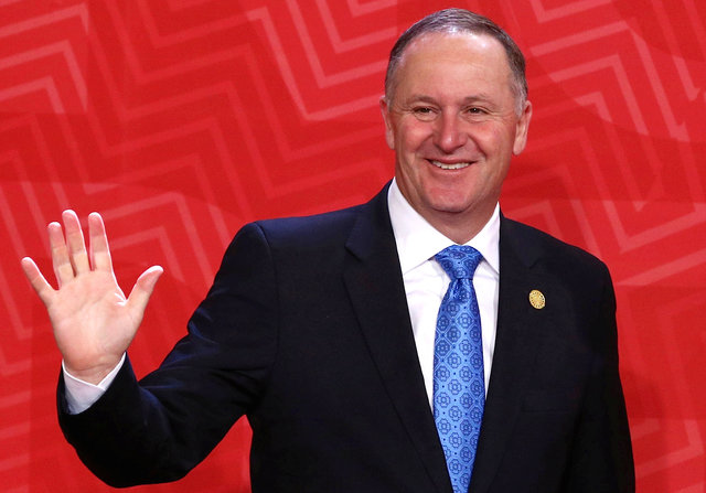 New Zealand's Prime Minister John Key waves to photographers during the APEC (Asia-Pacific Economic Cooperation) Summit in Lima, Peru, November 20, 2016.  (Photo: Reuters/ File Photo)