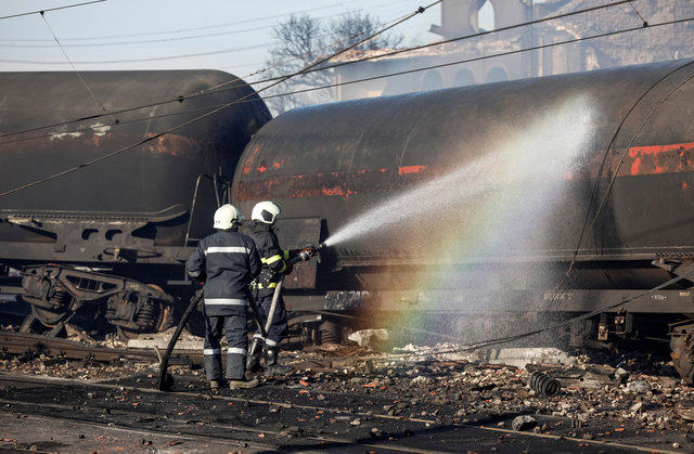 Firefighters work on the site where a cargo train derailed and exploded in the village of Hitrino, Bulgaria, December 10, 2016. (Photo: Reuters)