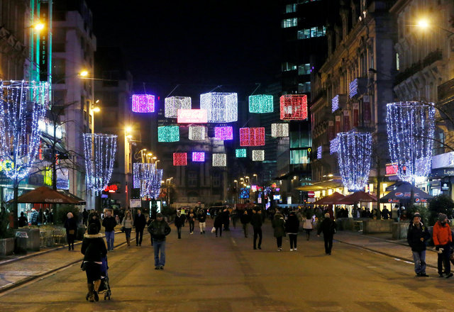 People walk along the Christmas market "Winter Wonders" (Plaisirs d'Hiver, Winter Pret) in central Brussels, Belgium. (Photo: Reuters)