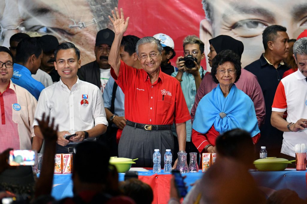 Go ahead, charge me over fake news, says Malaysia's Mahathir of plane